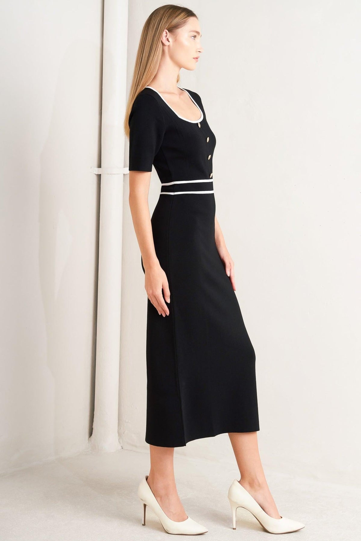 a woman in a black dress