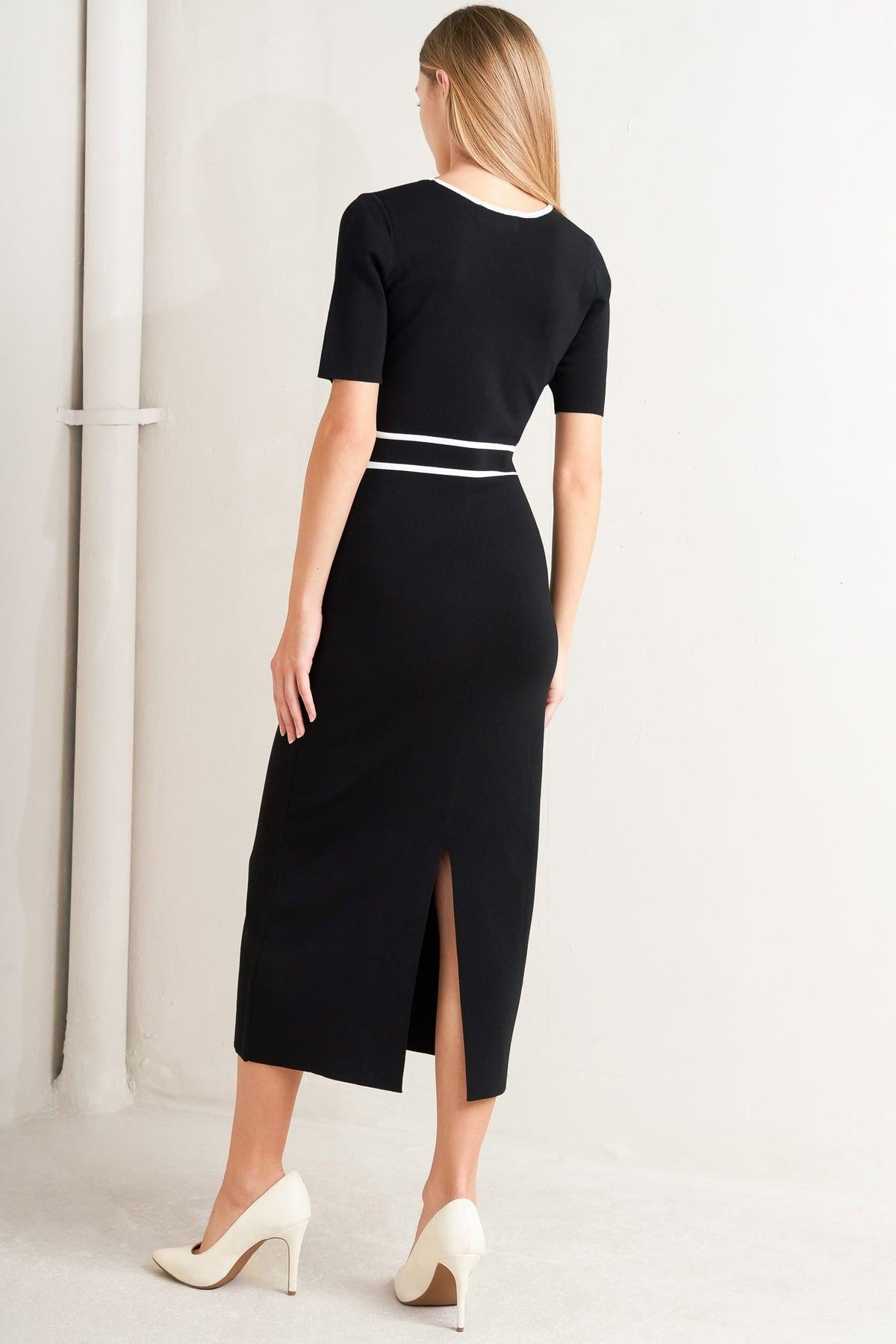 a woman in a black dress