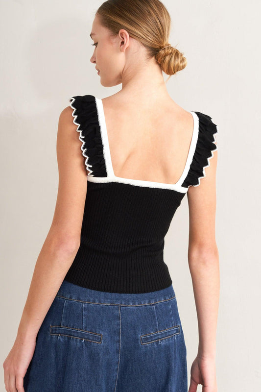 a woman in a black and white top