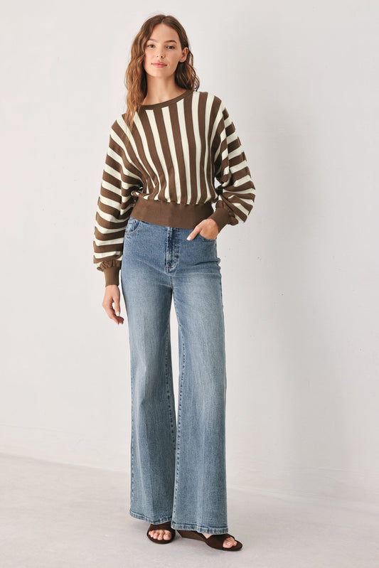 a woman in a striped sweater