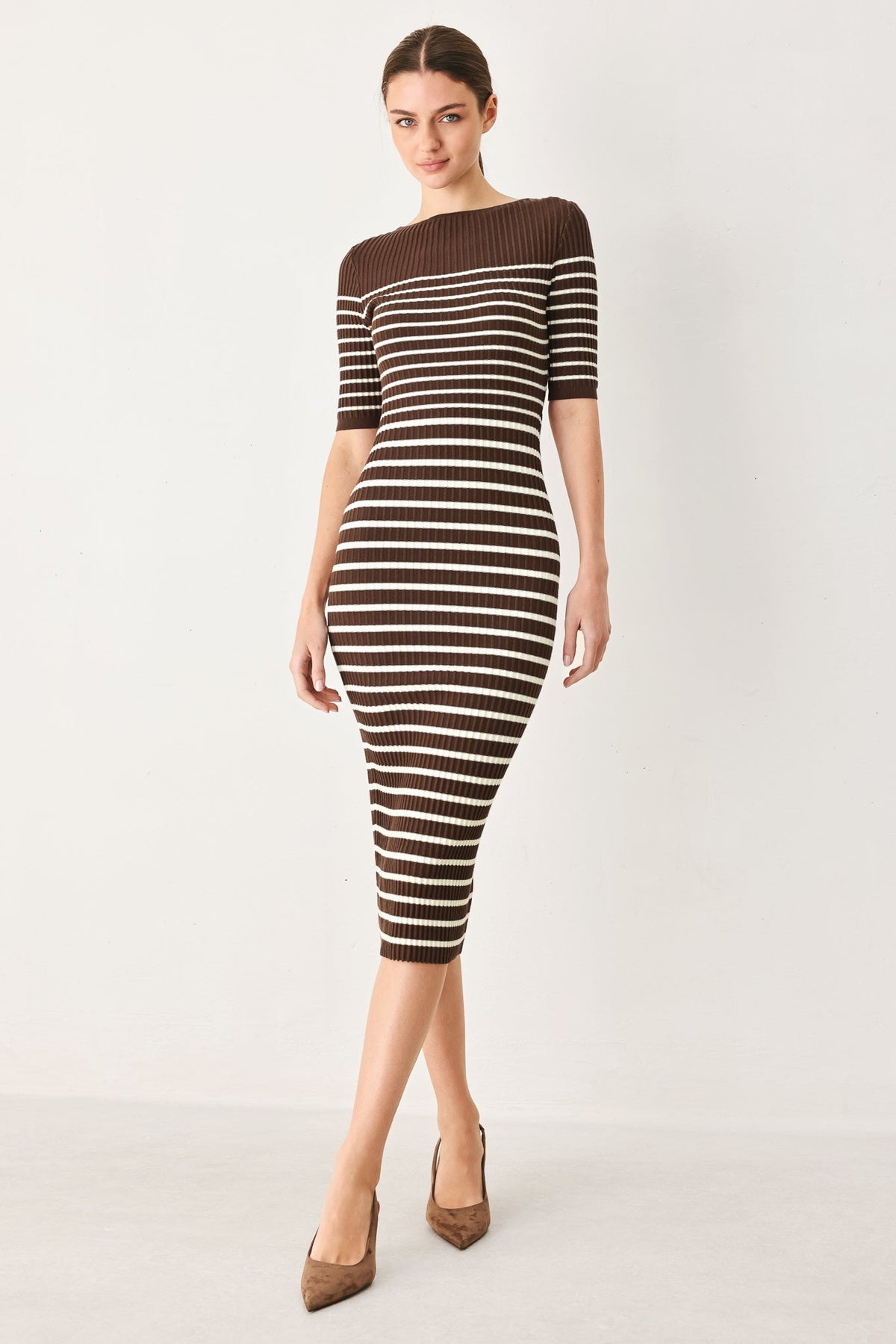 a woman in a striped dress