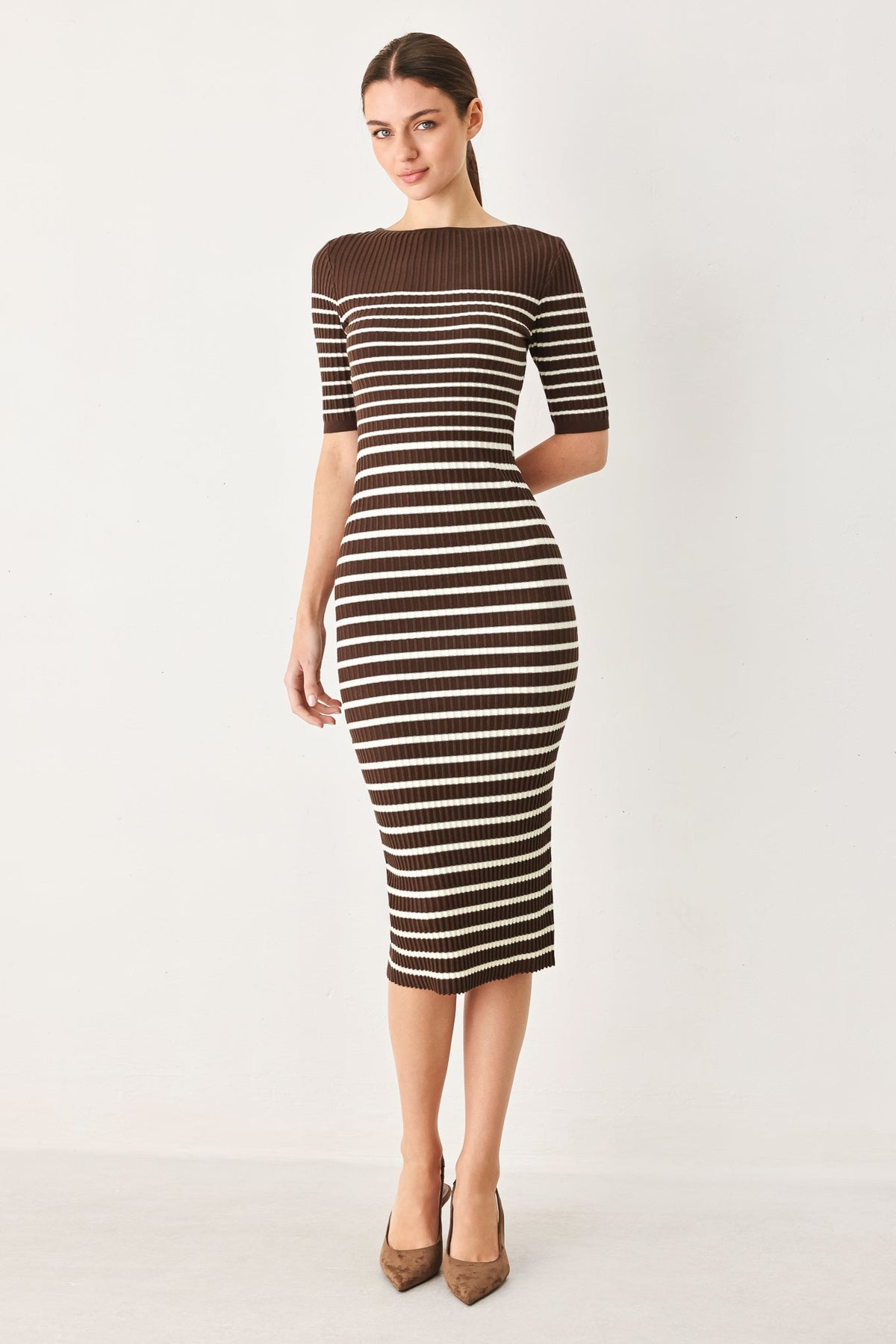 a woman in a striped dress