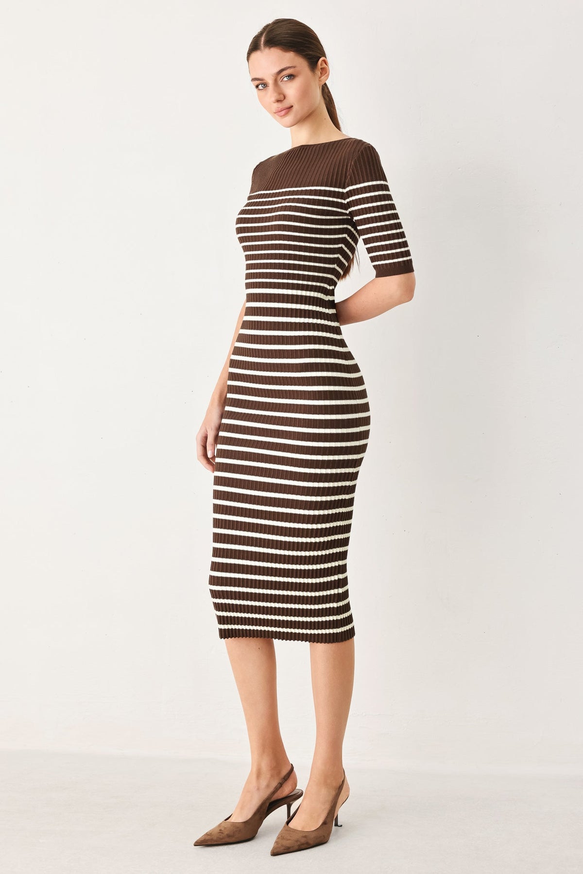 a woman in a striped dress