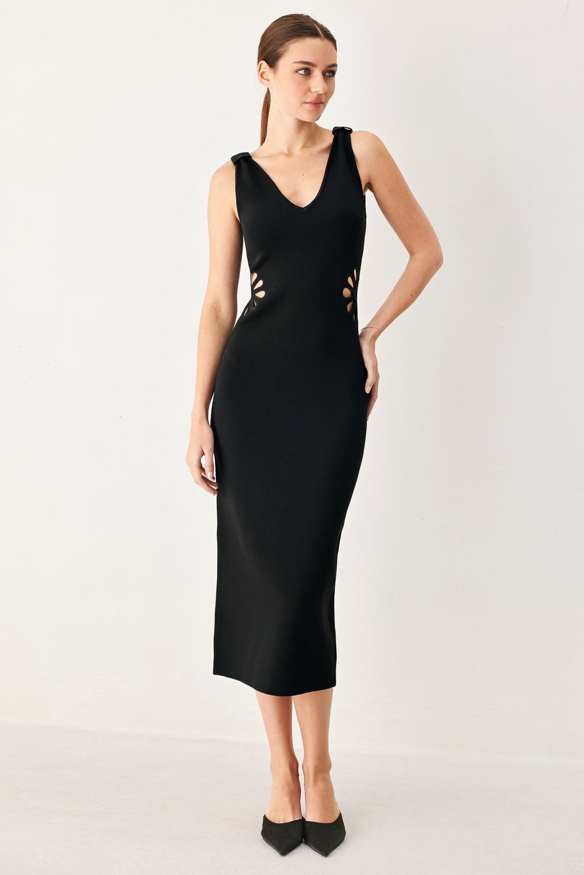 a woman in a black dress