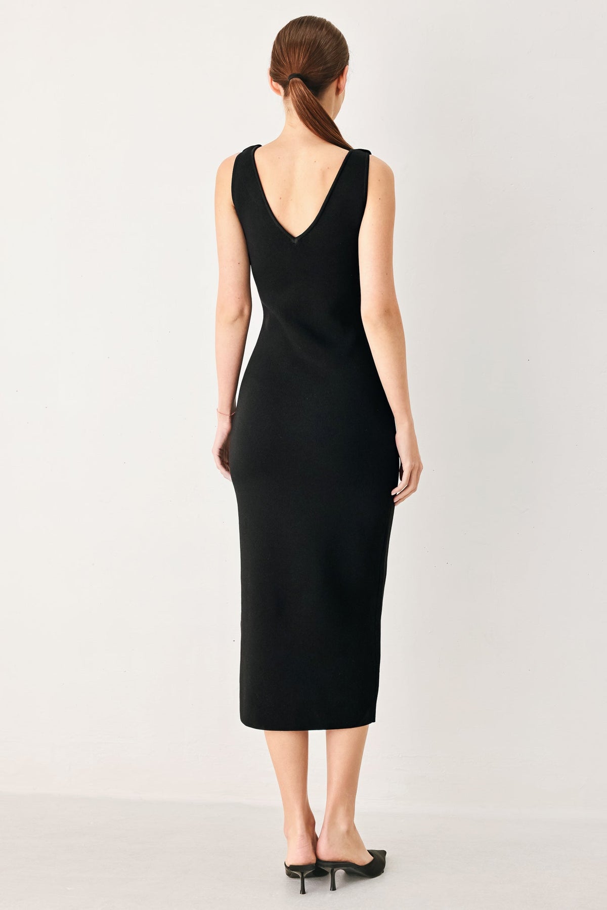 a woman in a black dress
