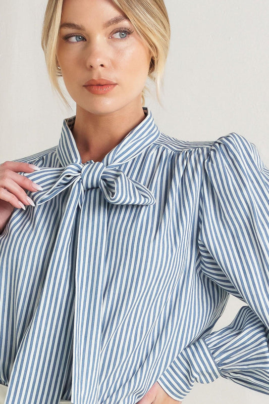 a woman wearing a striped shirt