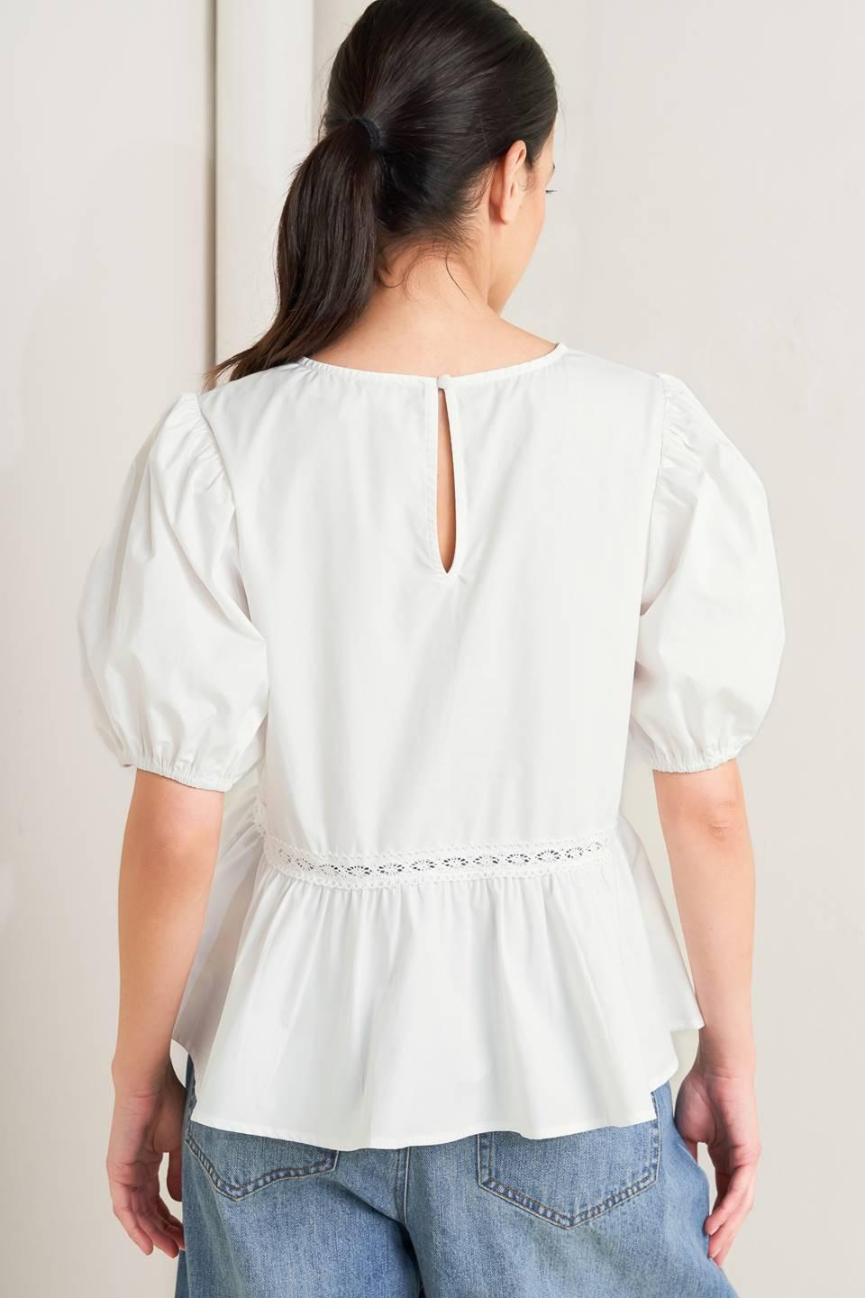 a woman in a white shirt