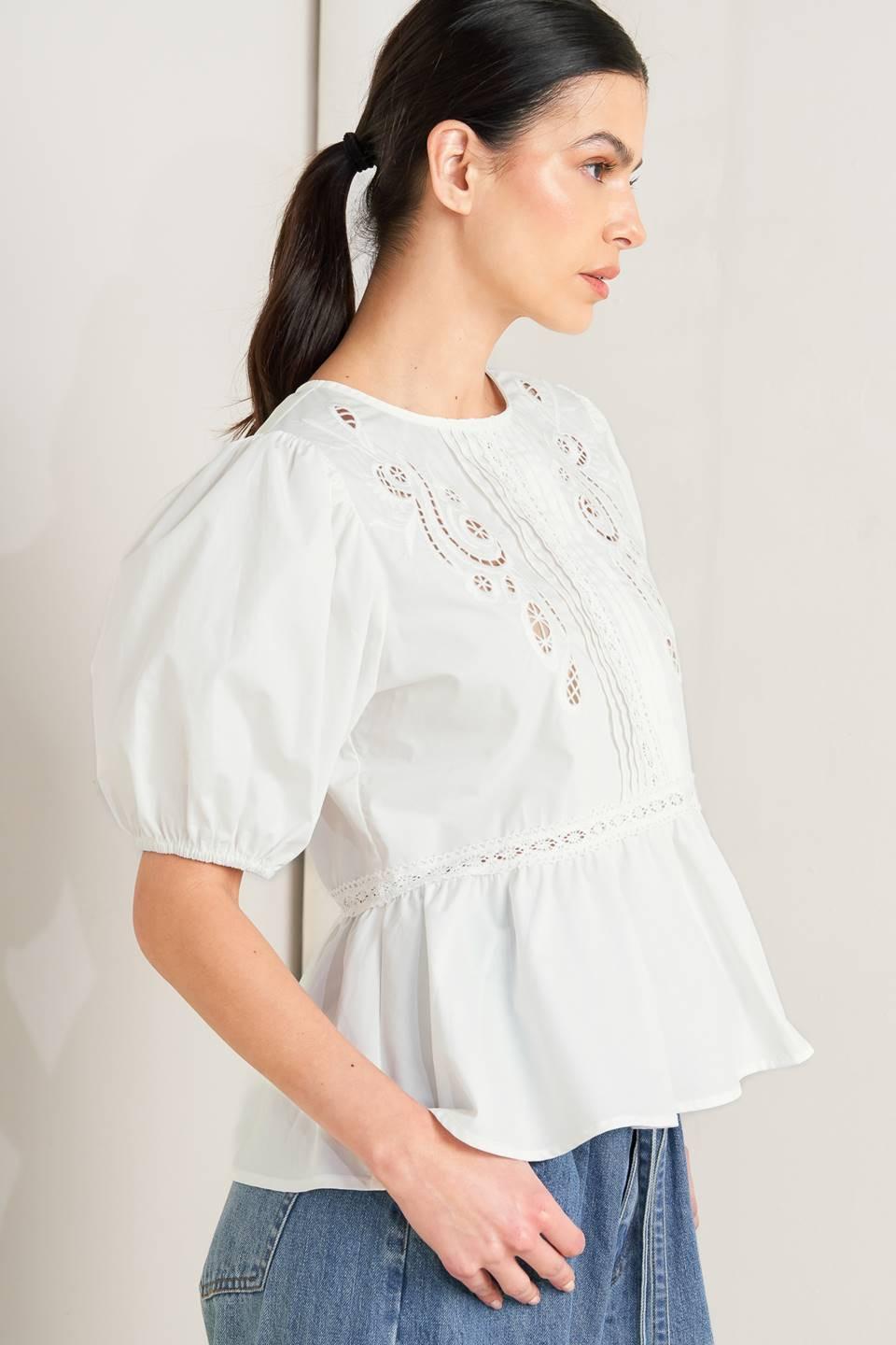 a woman in a white blouse