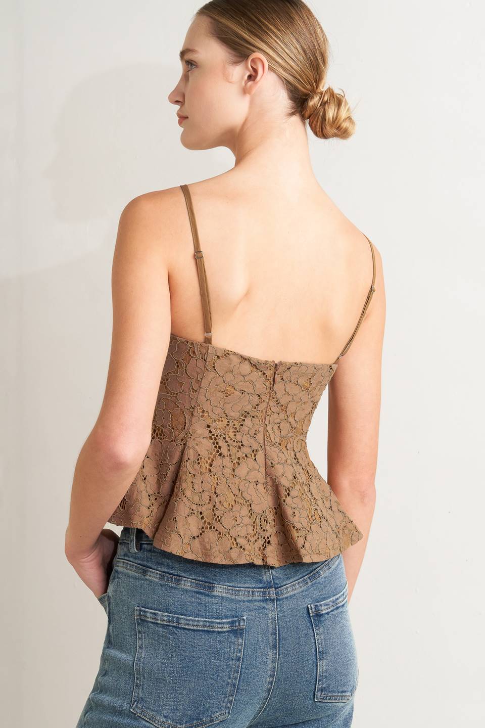 a woman in a brown top