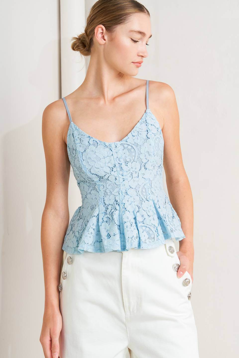 a woman in a blue lace top