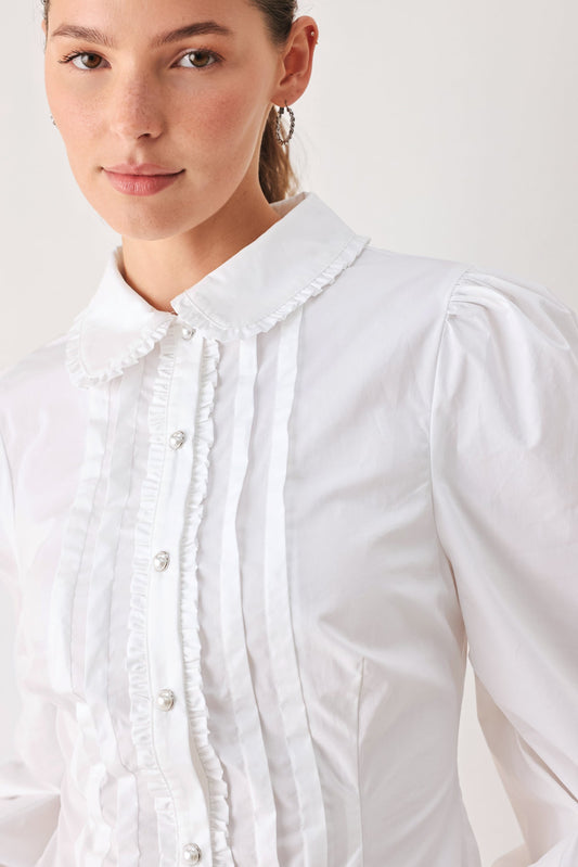 a woman in a white shirt