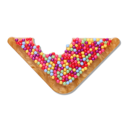 a piece of food with colorful balls