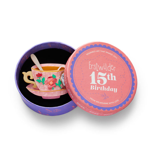 a small teacup in a round box