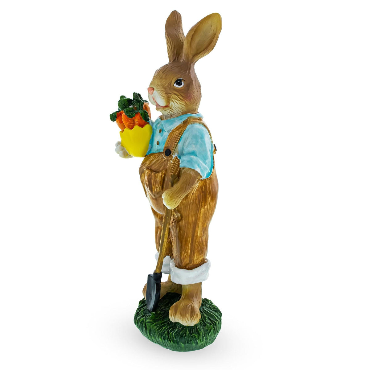 a statue of a rabbit holding a shovel and a carrot