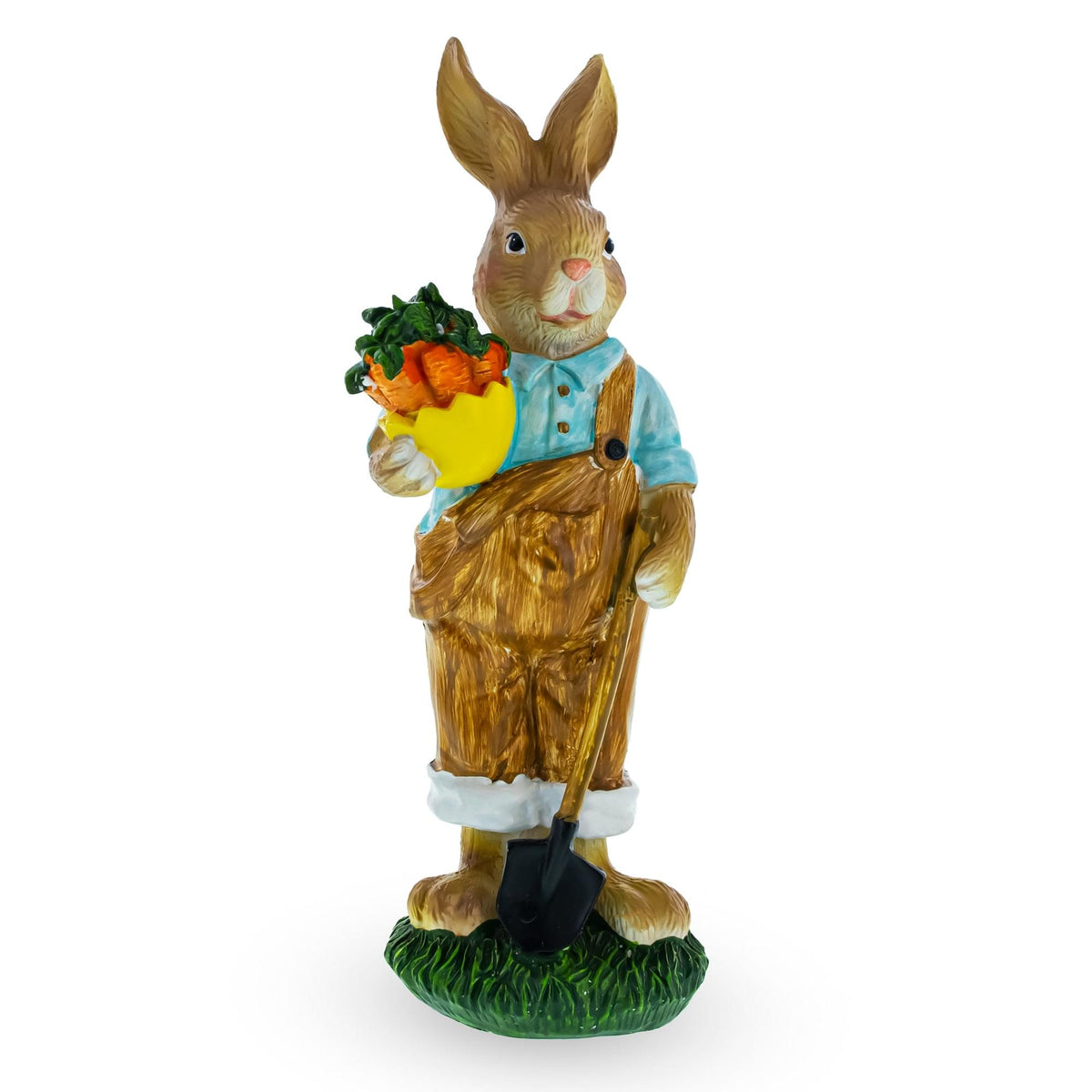 a statue of a rabbit holding a shovel and carrots