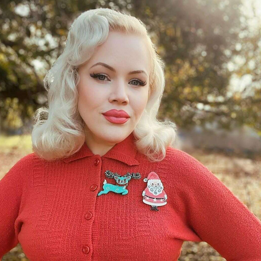 a woman with blonde hair wearing a red sweater