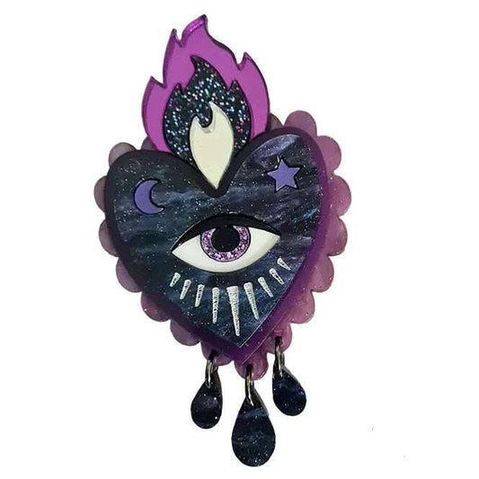 a heart with a eye and flames on it