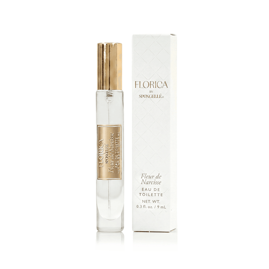a bottle of perfume with a box