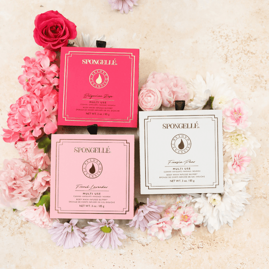 a group of pink and white boxes with flowers