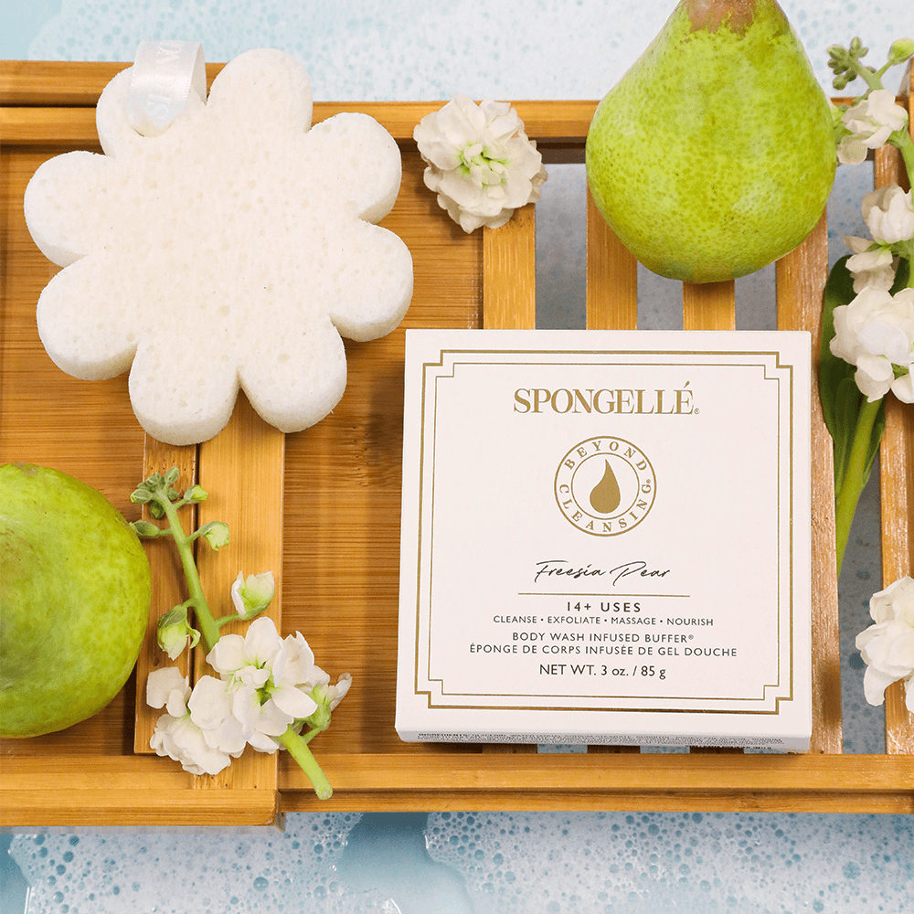 a wooden tray with fruit and sponges