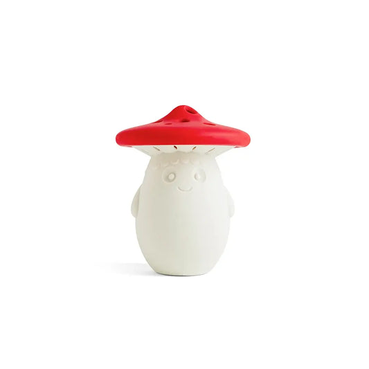 a white mushroom shaped object with a red cap