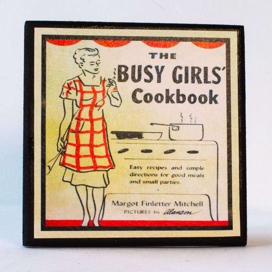 a sign with a woman in an apron