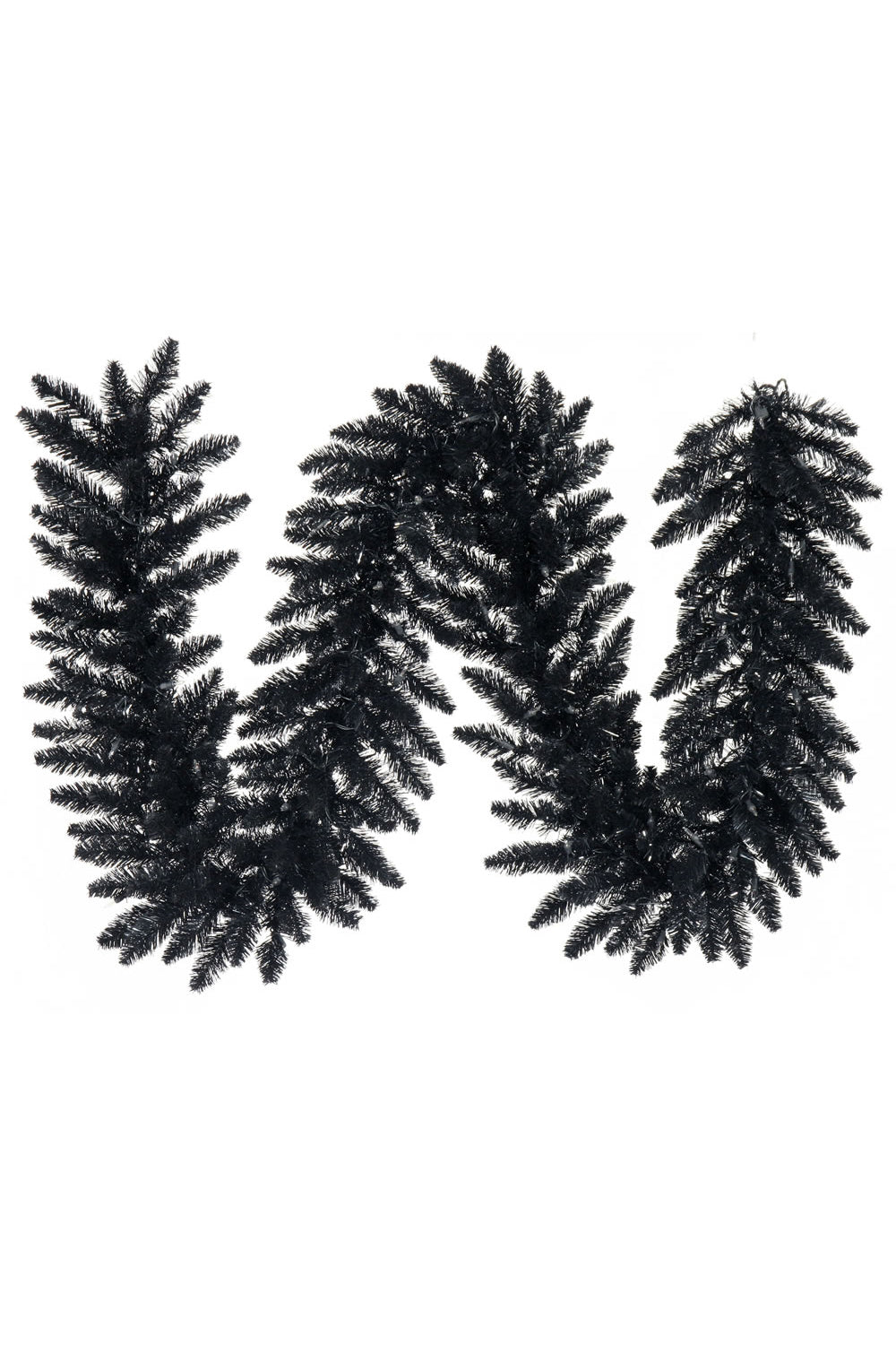 a black letter made of pine branches
