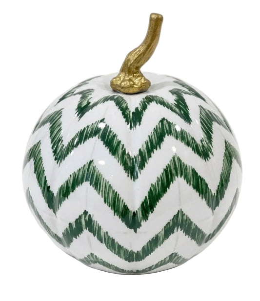 a white and green painted pumpkin