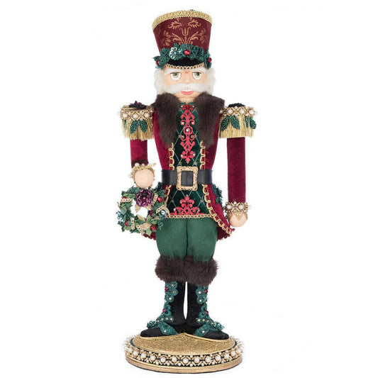 a toy nutcracker with a hat and skirt