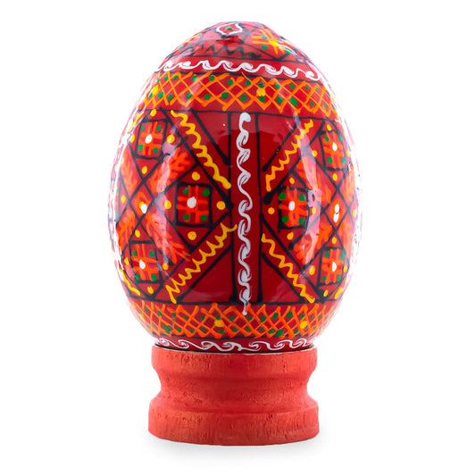 a red and orange egg with white patterns