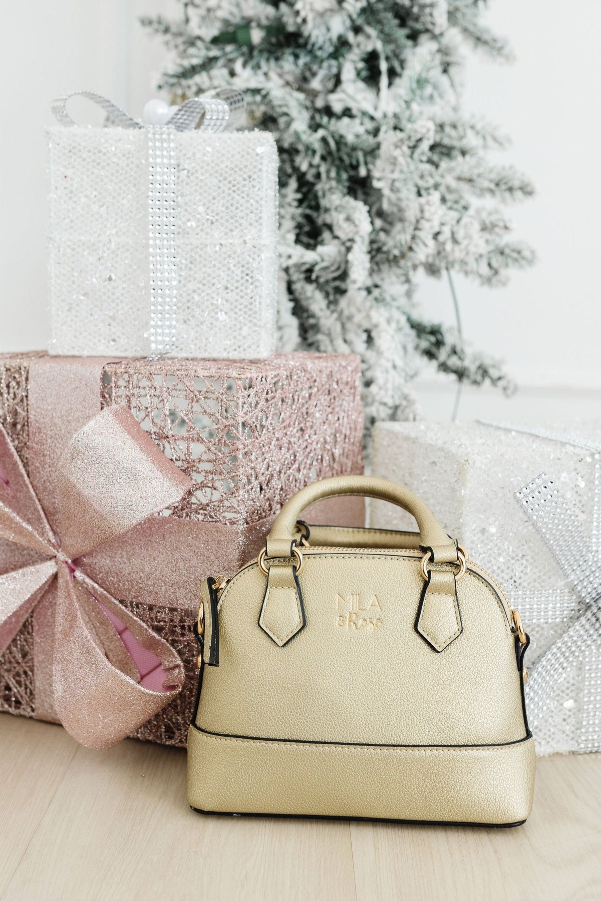 a bag and presents next to a tree