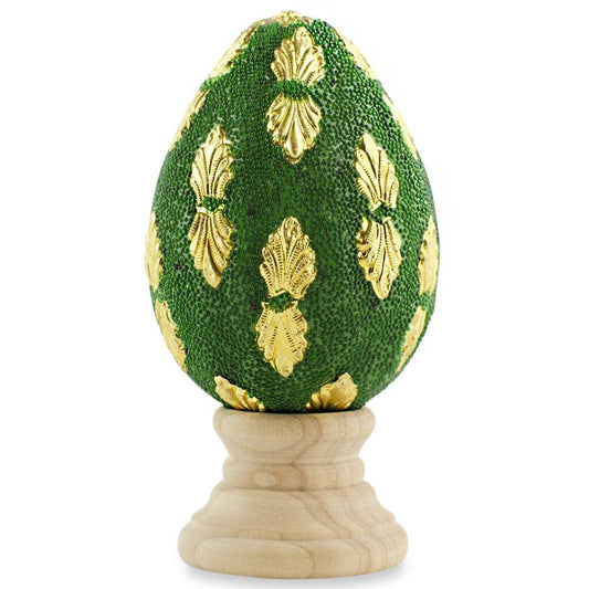 a green and gold egg shaped object