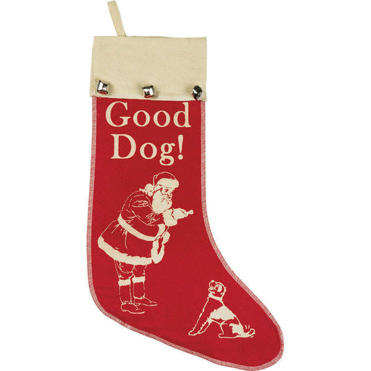 a red and white stocking with a santa claus and dog