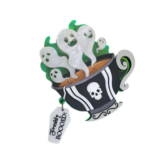 a black and white cup with white ghosts and a tag