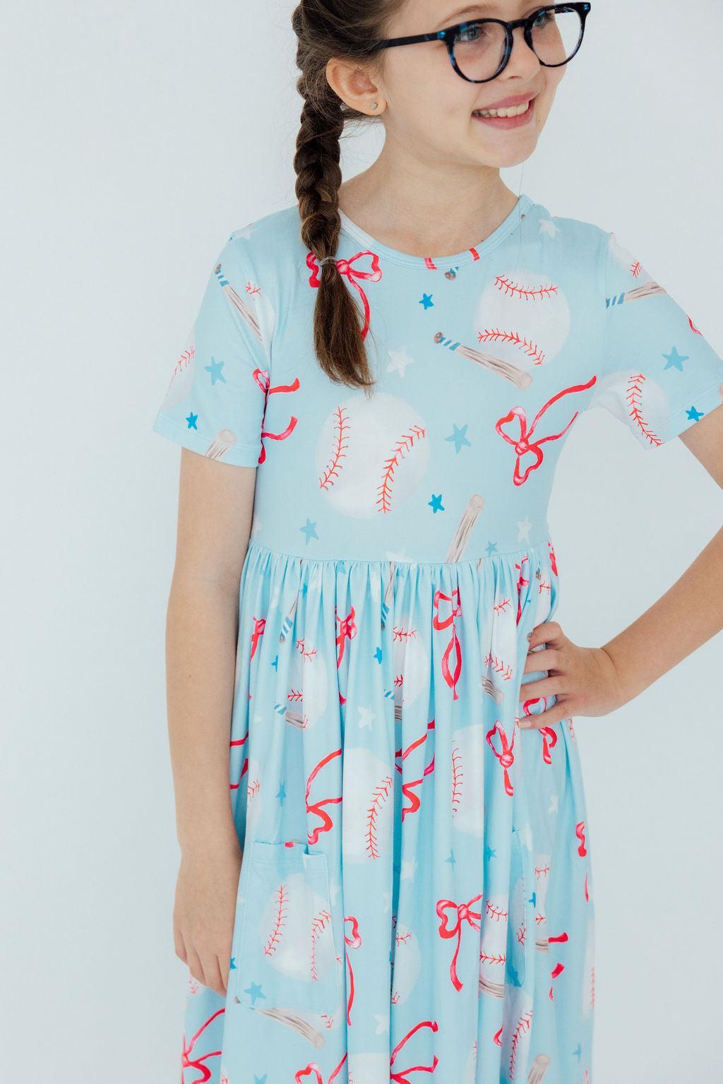 a girl wearing a blue dress