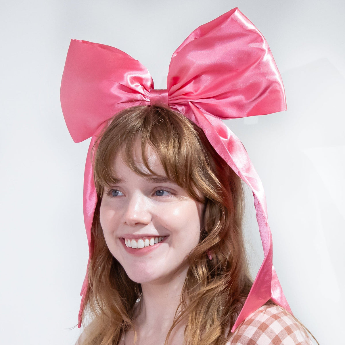 a woman with a large bow on her head