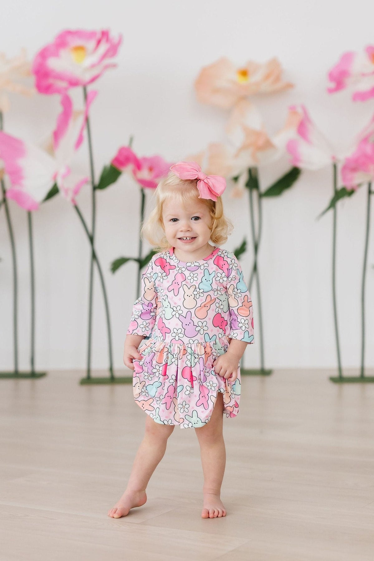 a girl smiling in a dress