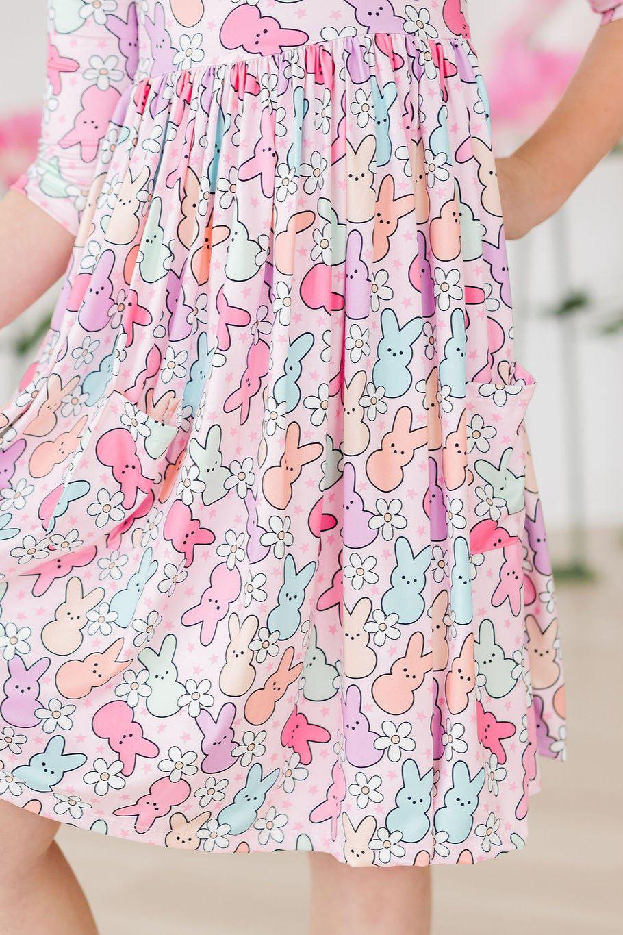 a person wearing a dress with bunny designs