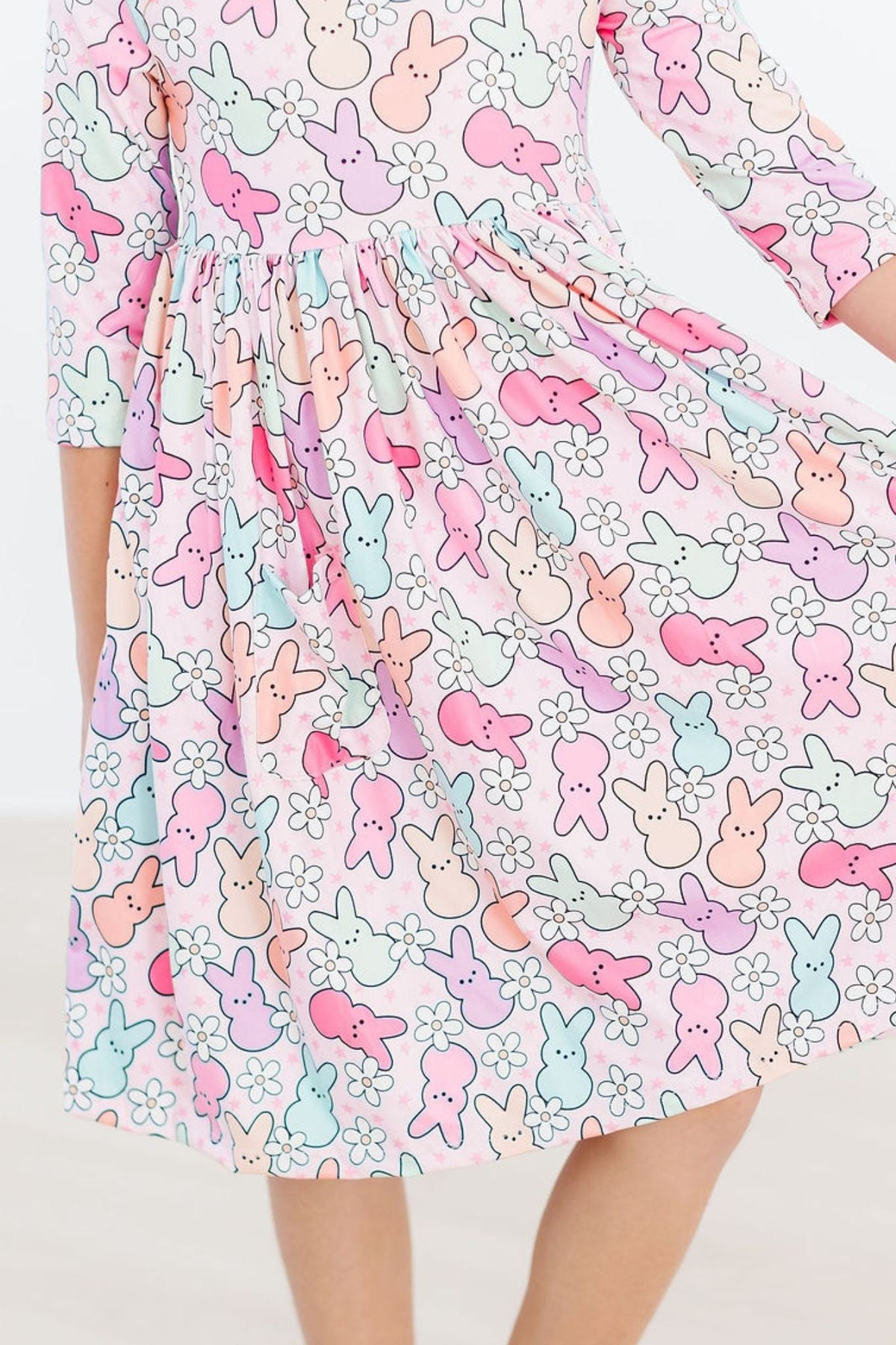 a person wearing a dress with bunny designs