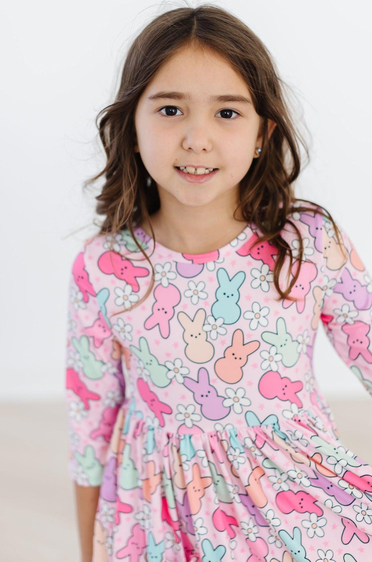 a girl in a pink dress