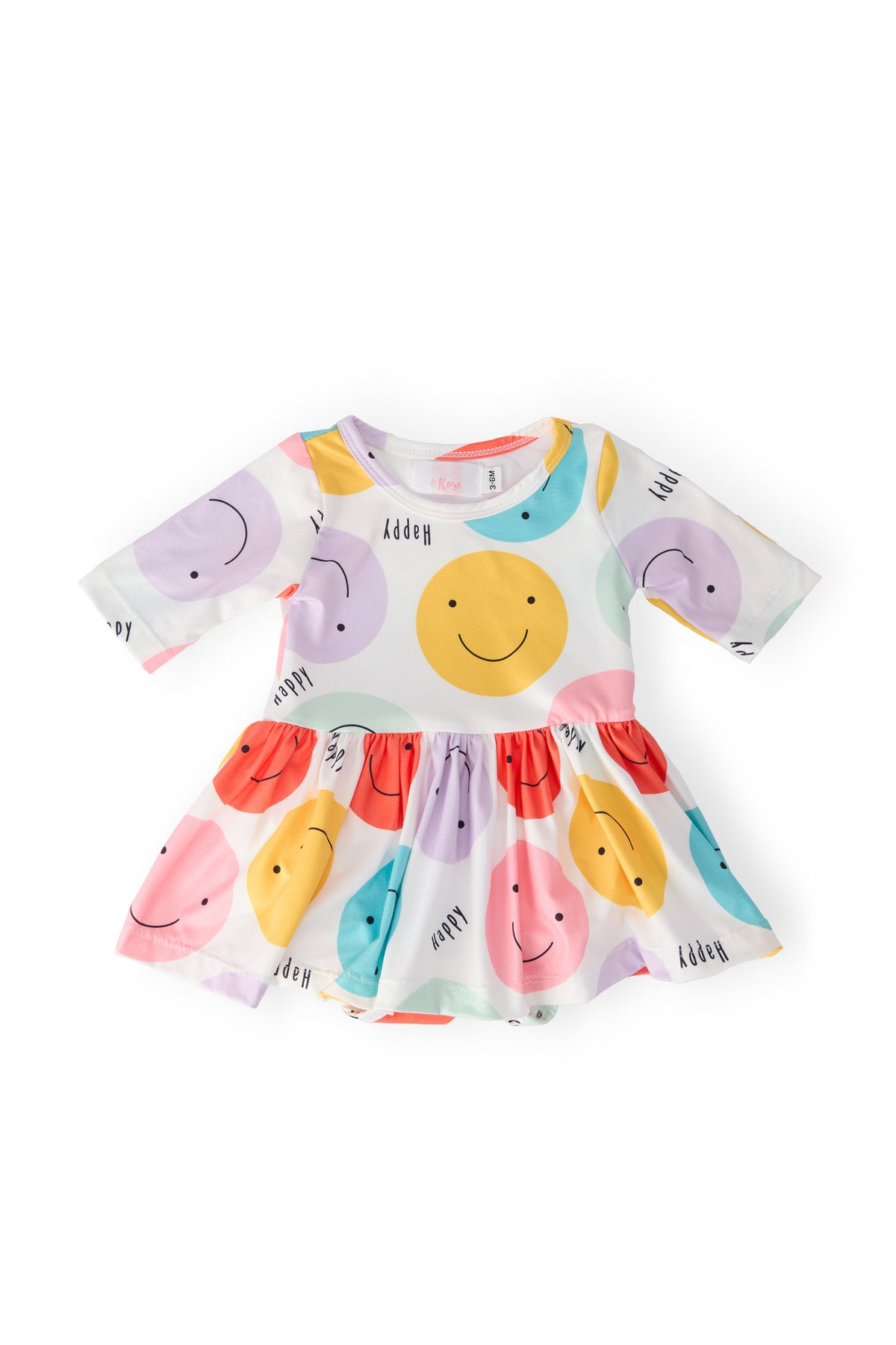 a baby dress with colorful circles on it