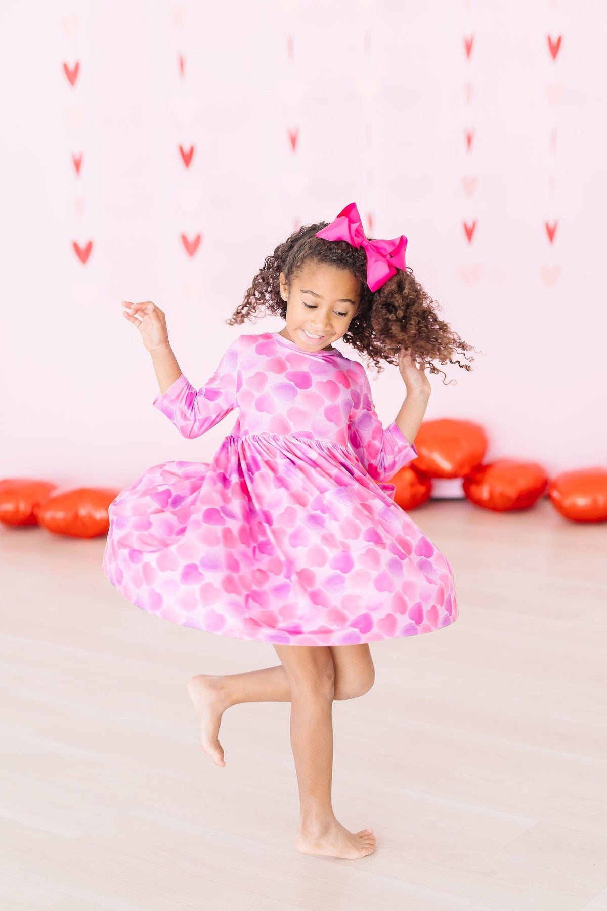 a girl in a pink dress