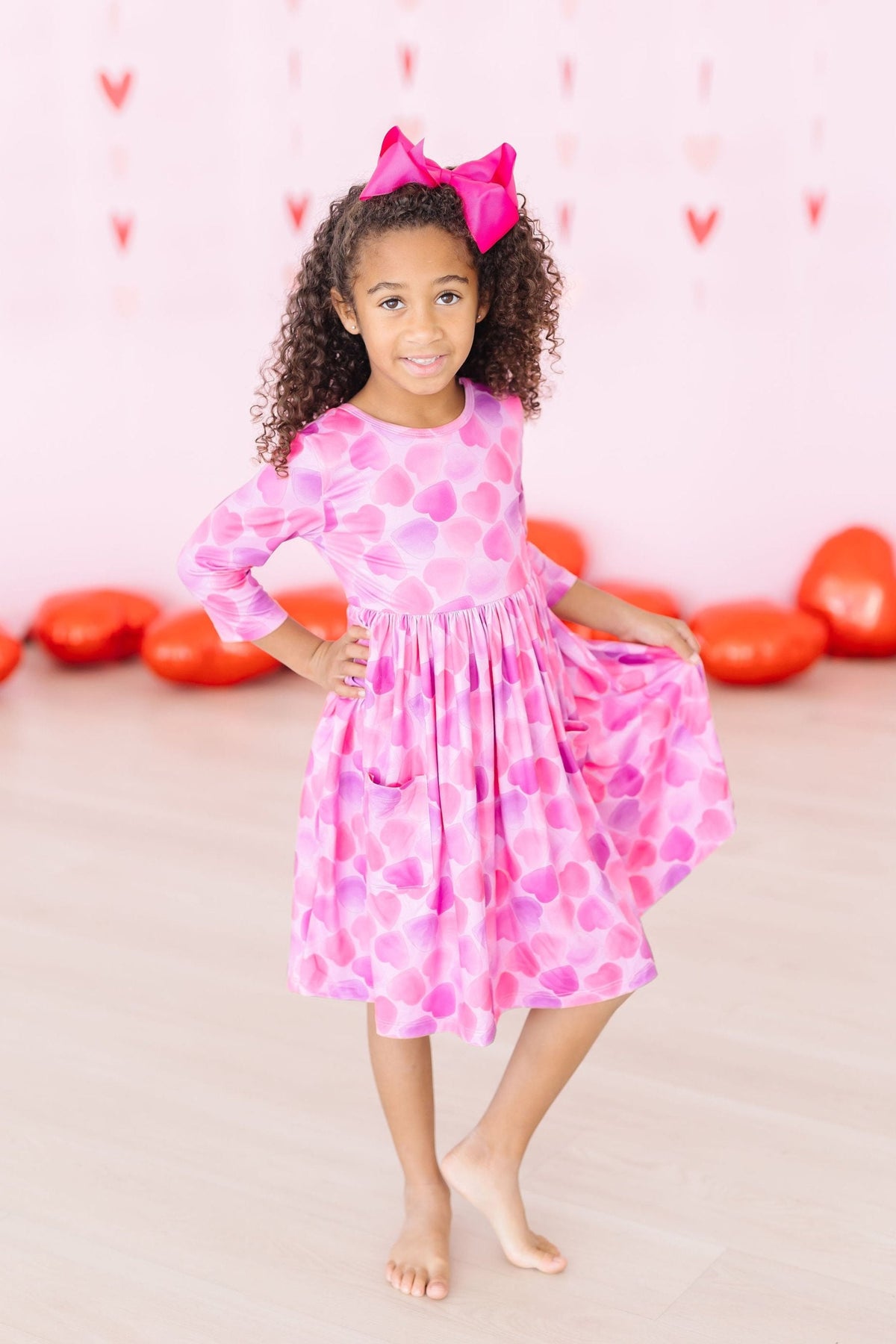a girl in a pink dress