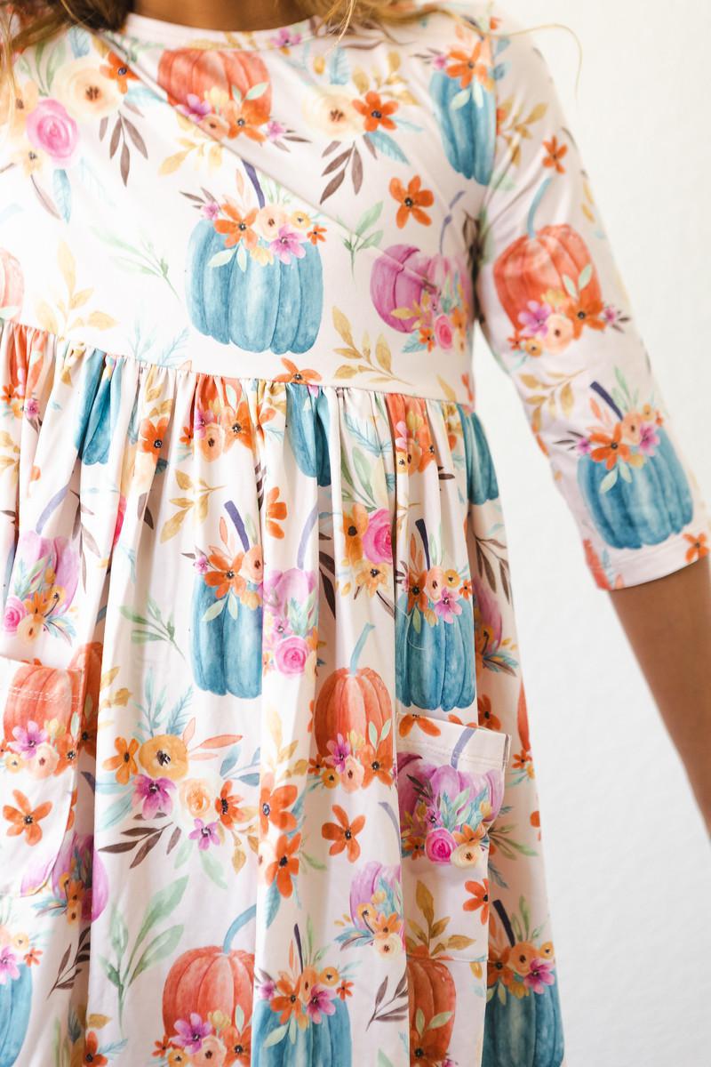 a woman wearing a floral dress