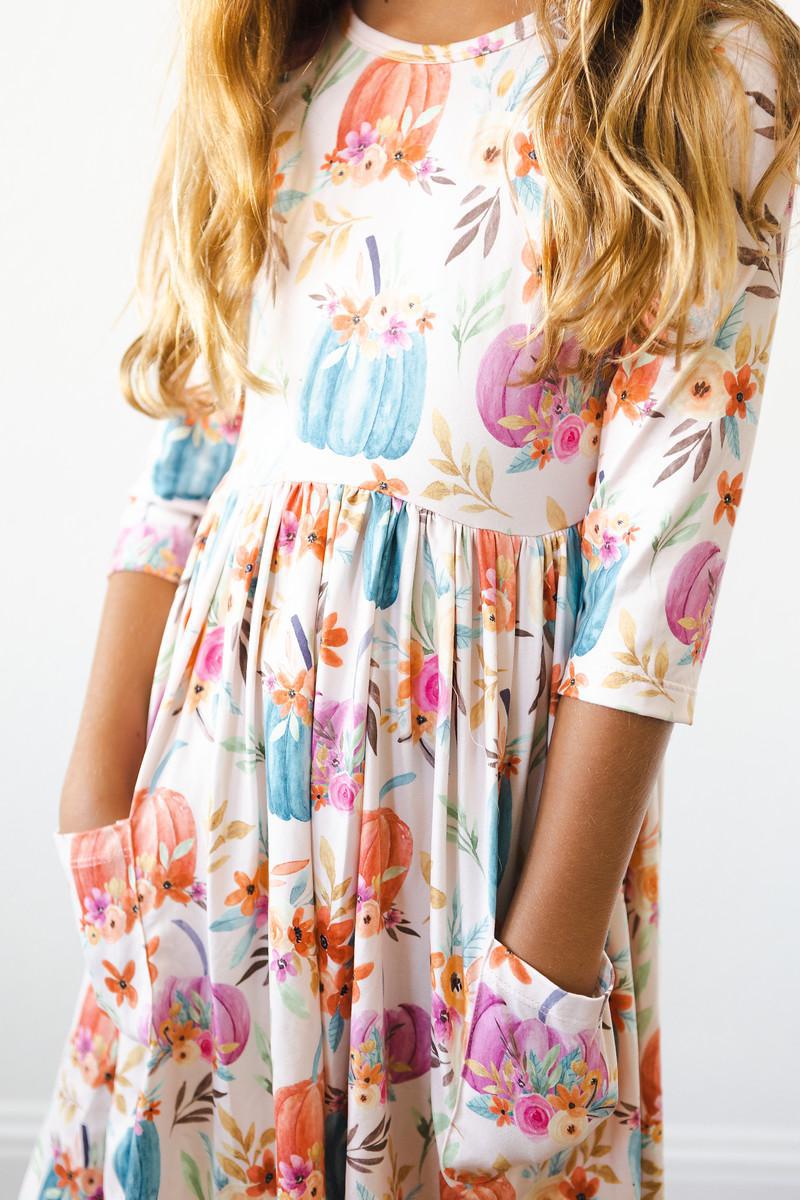 a girl wearing a floral dress