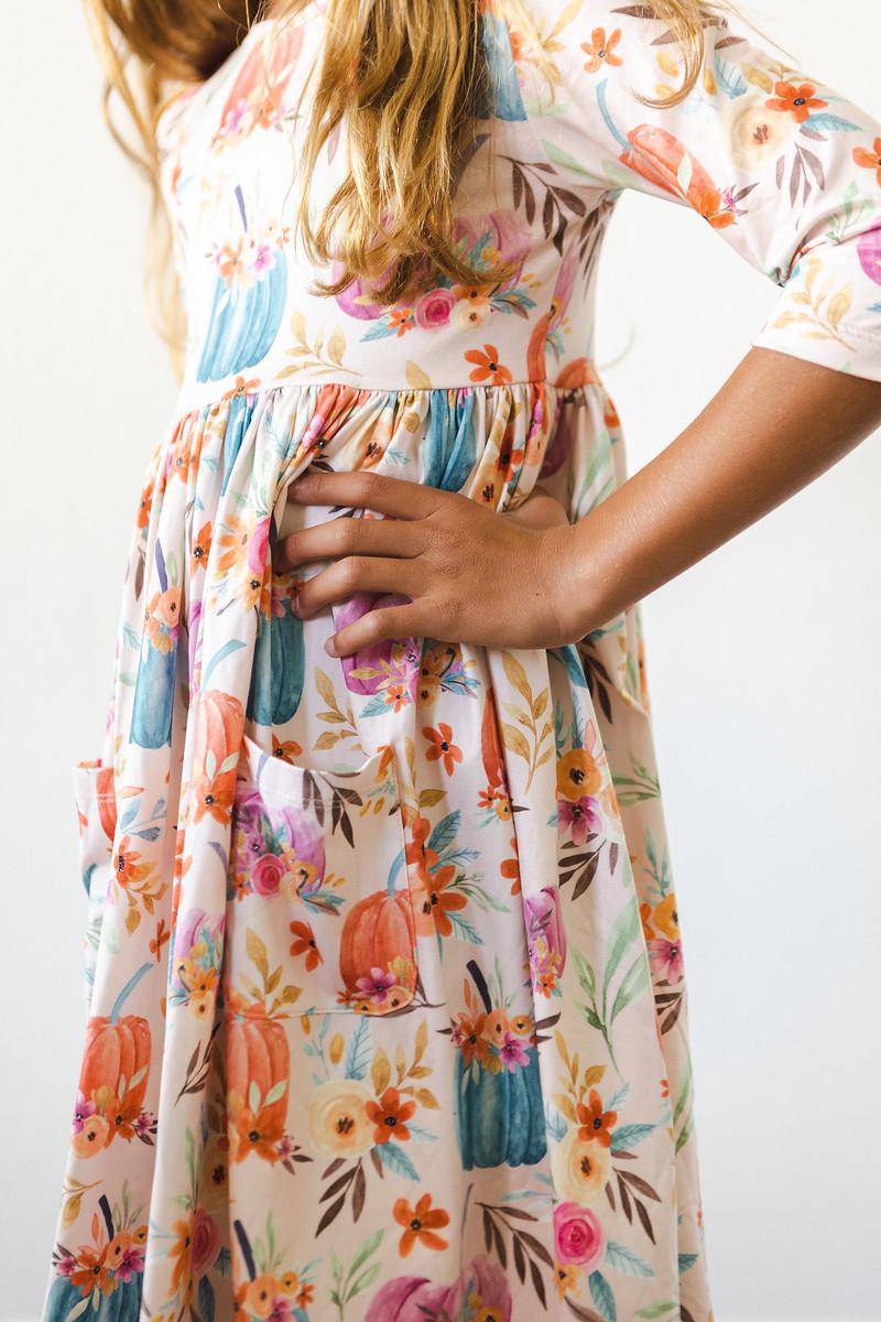 a woman wearing a floral dress