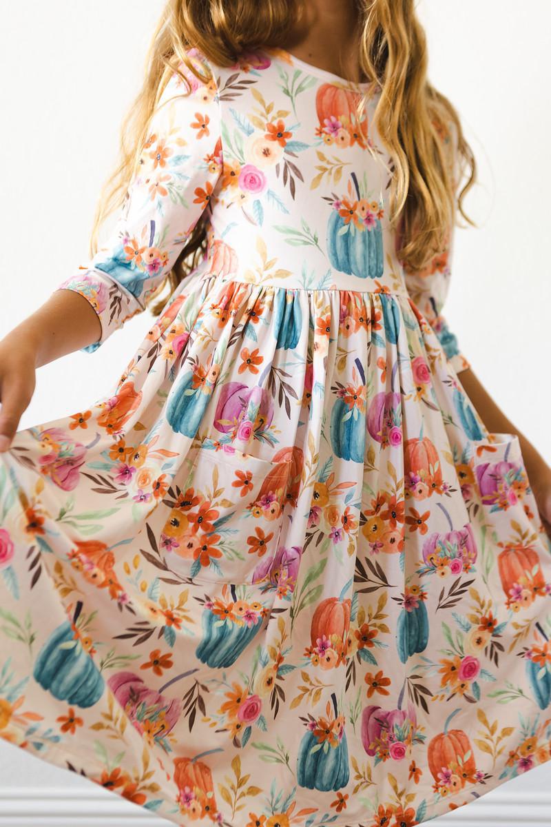 a girl wearing a floral dress