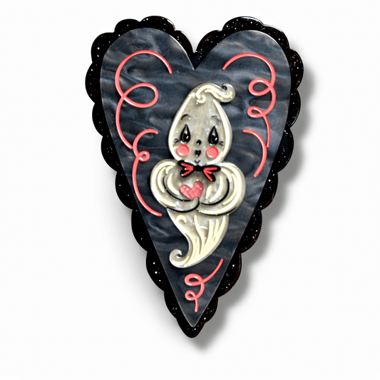 a heart shaped object with a ghost