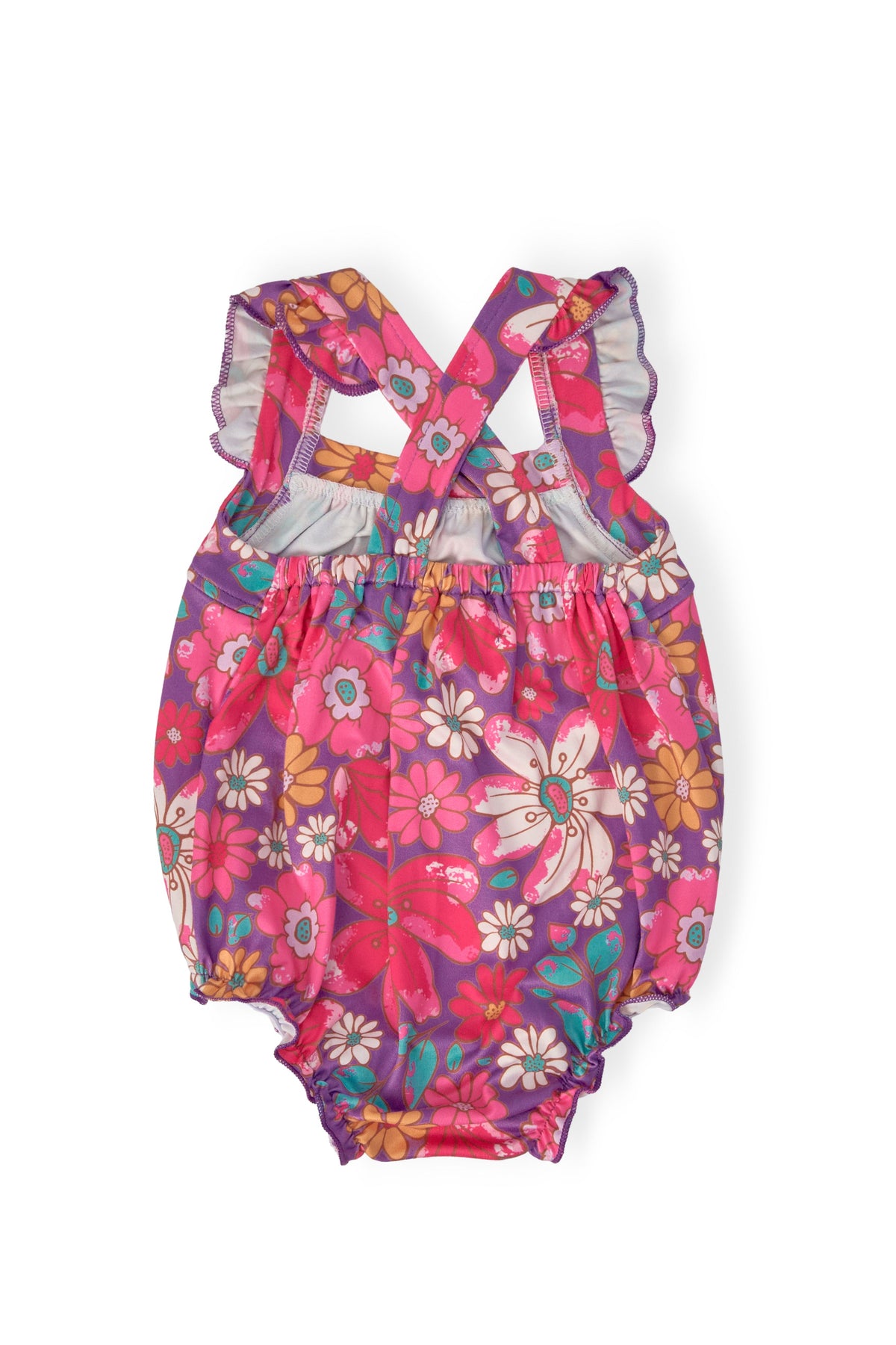a pink and purple romper with flowers on it