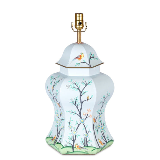 a white lamp with birds on it